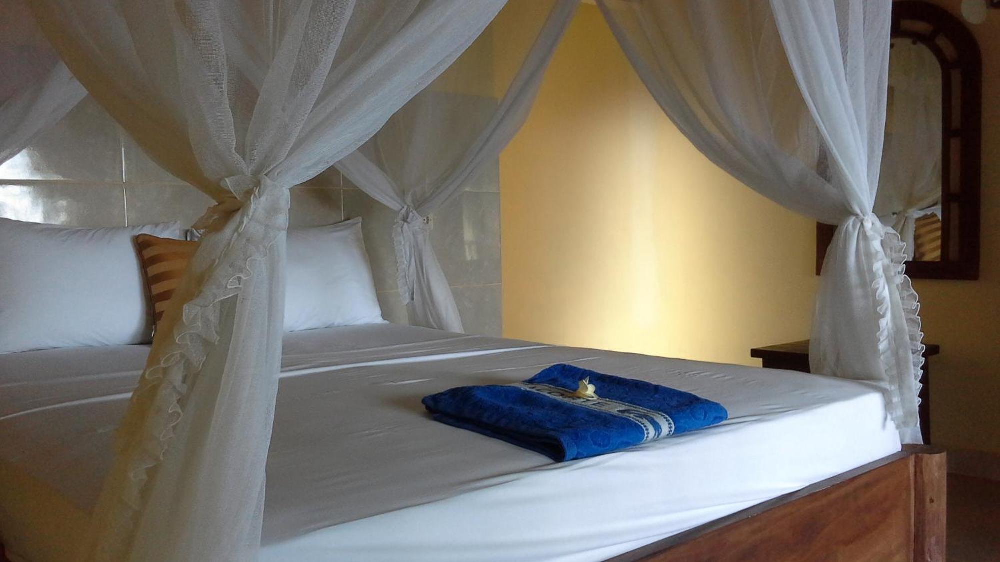 Rumahku Homestay Амед Номер фото